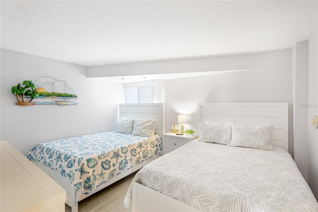 625 Beach Road, Unit 407 Sarasota, FL 34242 - Photo 19 of 43 a bedroom with a bed and window