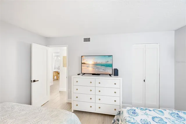 a living room with furniture and flat screen tv