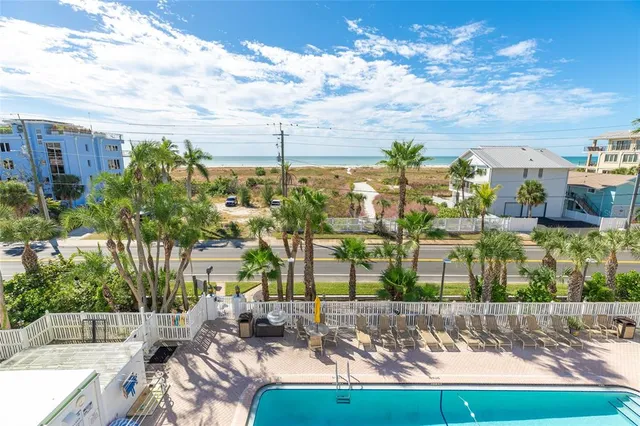 a view of a patio with table and chairs and potted plants