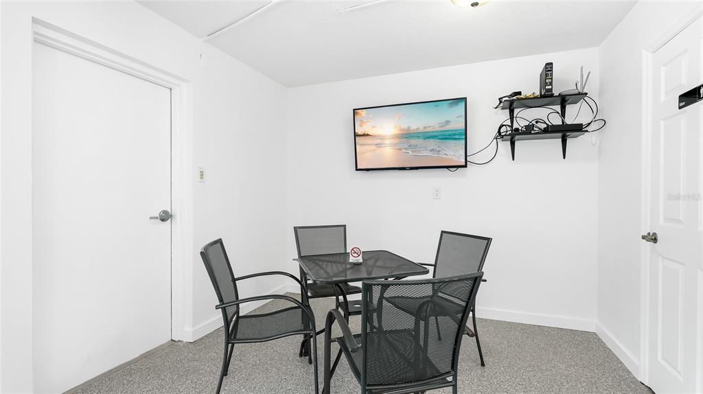 625 Beach Road, Unit 407 Sarasota, FL 34242 - Photo 41 of 43 a view of a dining room with furniture