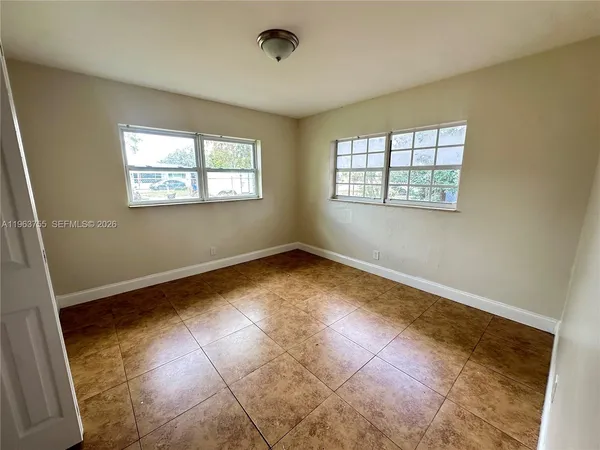 an empty room with windows