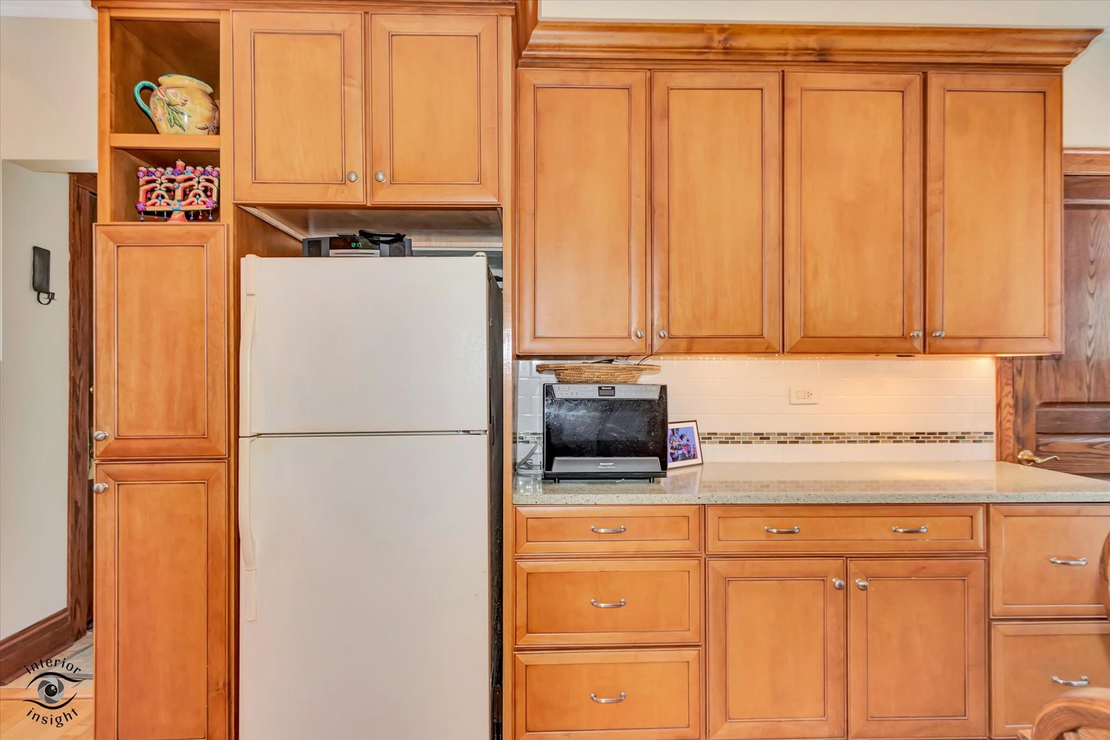 1650 West 105th Street Chicago, IL 60643 - Photo 16 of 43 a white refrigerator freezer sitting in a kitchen