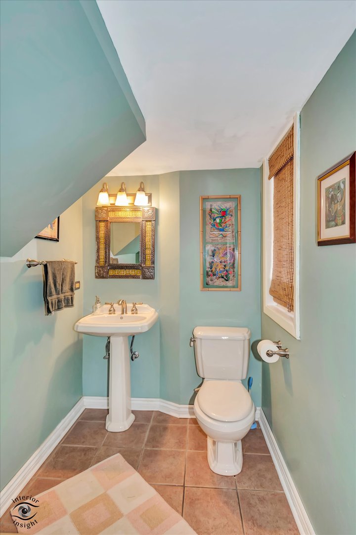 1650 West 105th Street Chicago, IL 60643 - Photo 23 of 43 a bathroom with a toilet a sink and a mirror