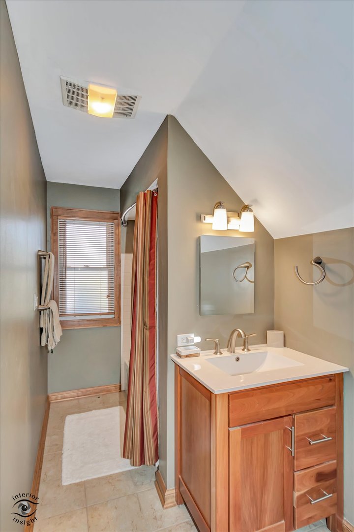 1650 West 105th Street Chicago, IL 60643 - Photo 30 of 43 a bathroom with a sink and a mirror
