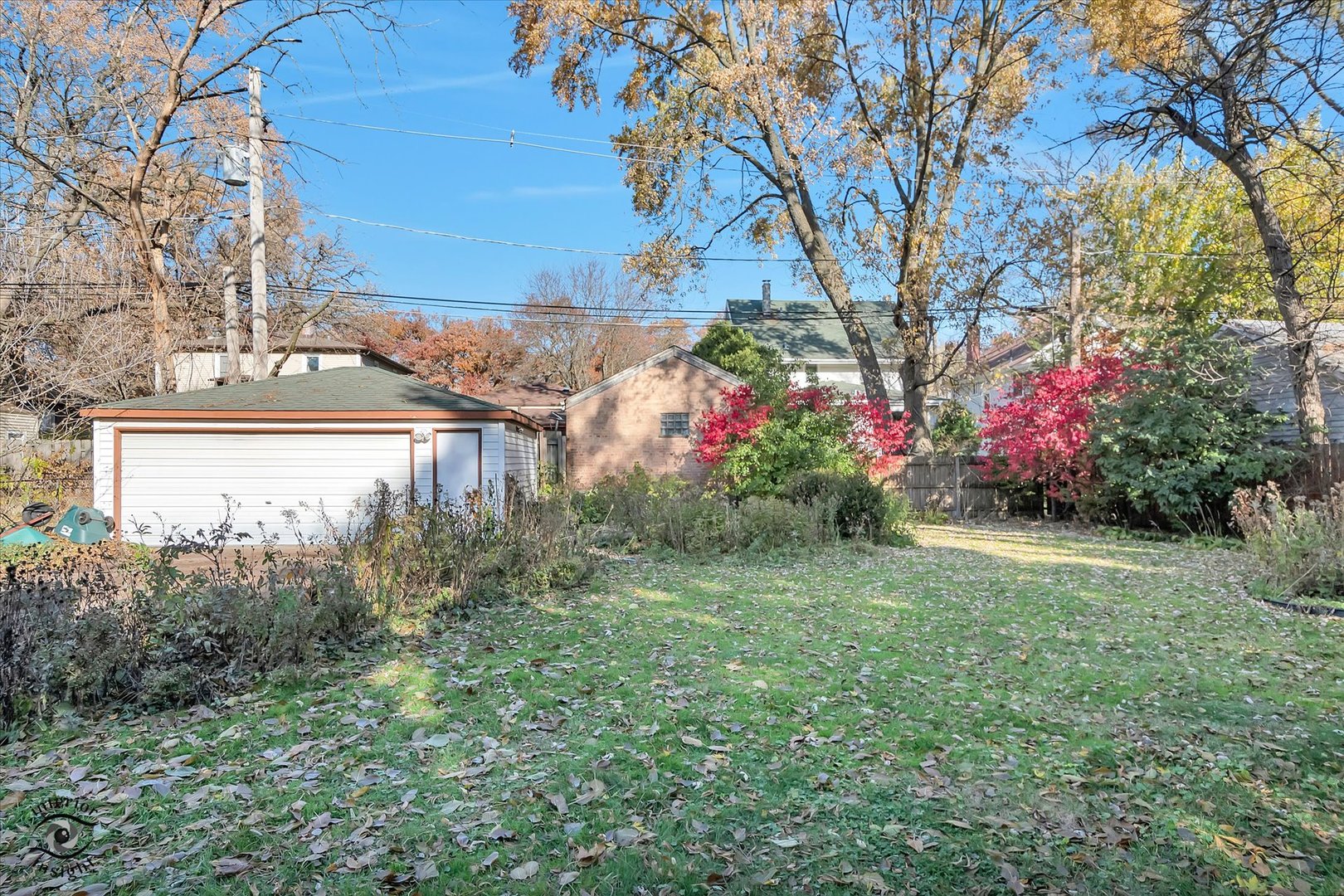 1650 West 105th Street Chicago, IL 60643 - Photo 38 of 43 a front view of a house with a yard and fountain in middle