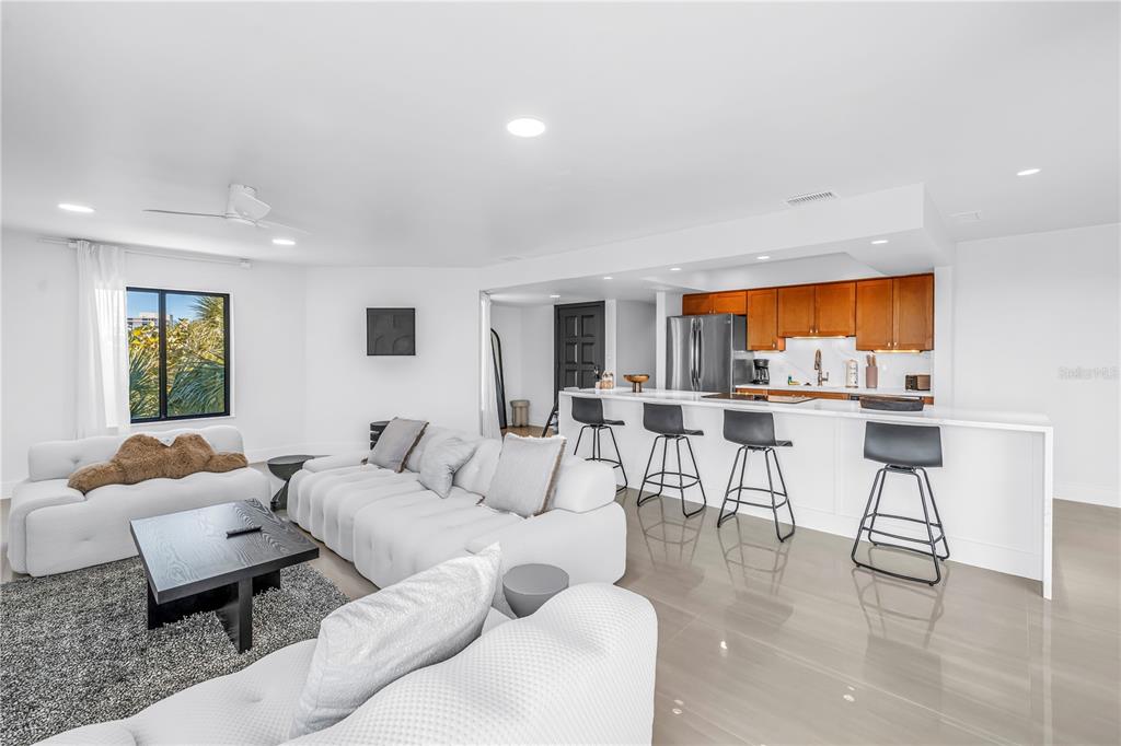 450 Beach Road, Unit 4 Sarasota, FL 34242 - Photo 11 of 64 a living room with furniture and a large window