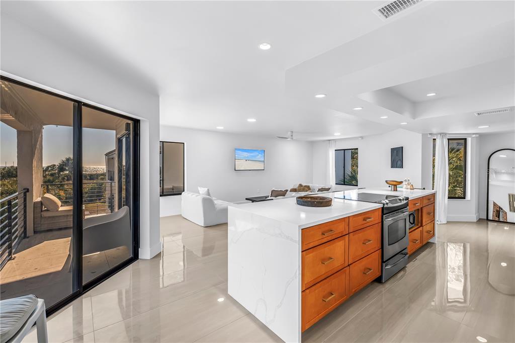 450 Beach Road, Unit 4 Sarasota, FL 34242 - Photo 12 of 64 a large kitchen with a stove top oven