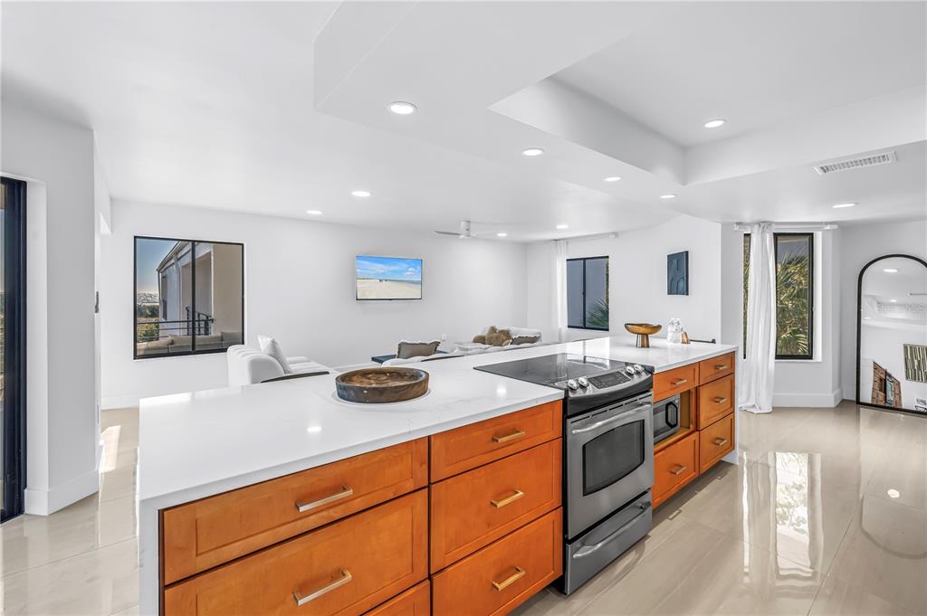 450 Beach Road, Unit 4 Sarasota, FL 34242 - Photo 13 of 64 a kitchen with stainless steel appliances granite countertop a stove and a sink
