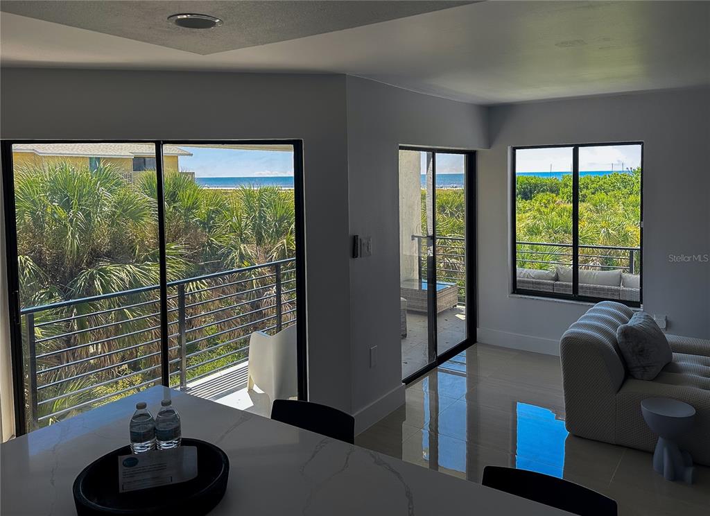 450 Beach Road, Unit 4 Sarasota, FL 34242 - Photo 17 of 64 a living room with furniture and a large window