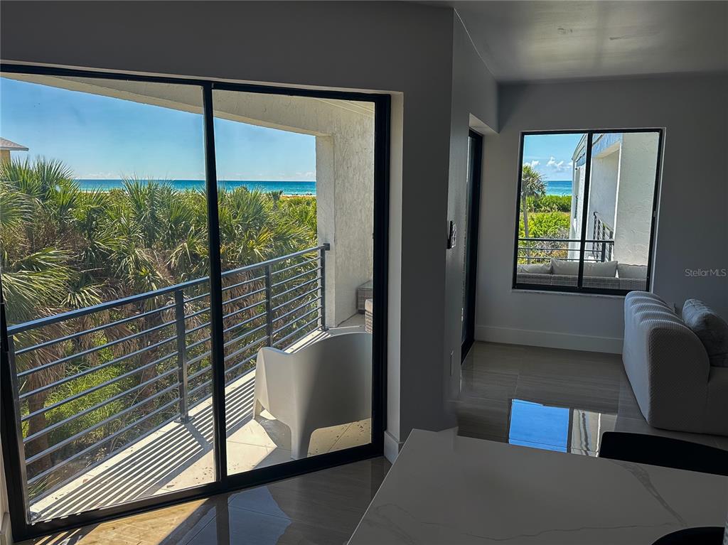 450 Beach Road, Unit 4 Sarasota, FL 34242 - Photo 18 of 64 a view of two large window and a balcony