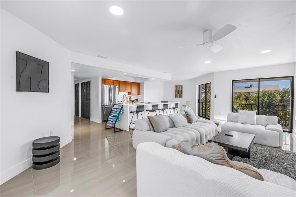 450 Beach Road, Unit 4 Sarasota, FL 34242 - Photo 21 of 64 a living room with furniture and a flat screen tv