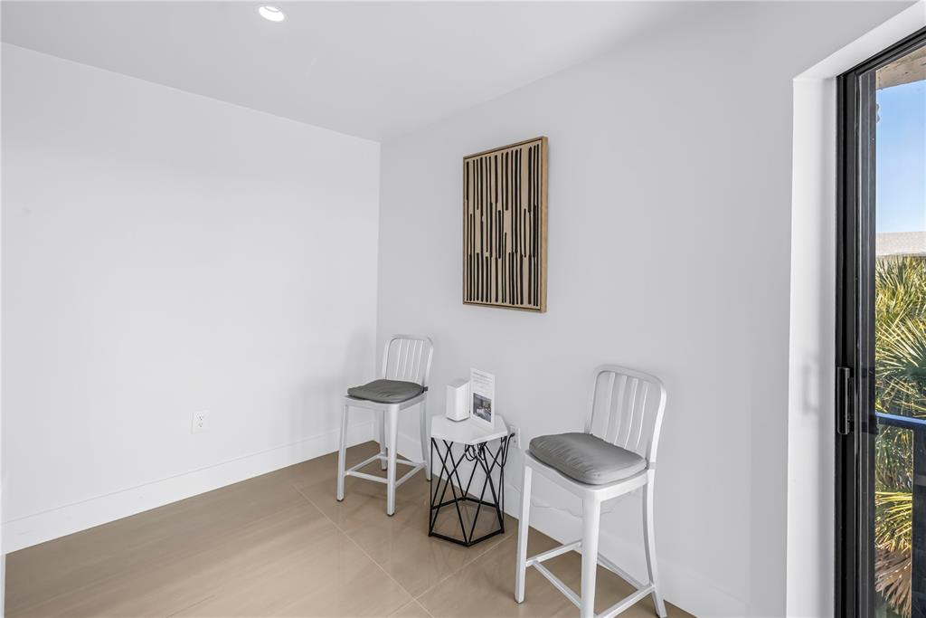 450 Beach Road, Unit 4 Sarasota, FL 34242 - Photo 23 of 64 a dining room with furniture and a window