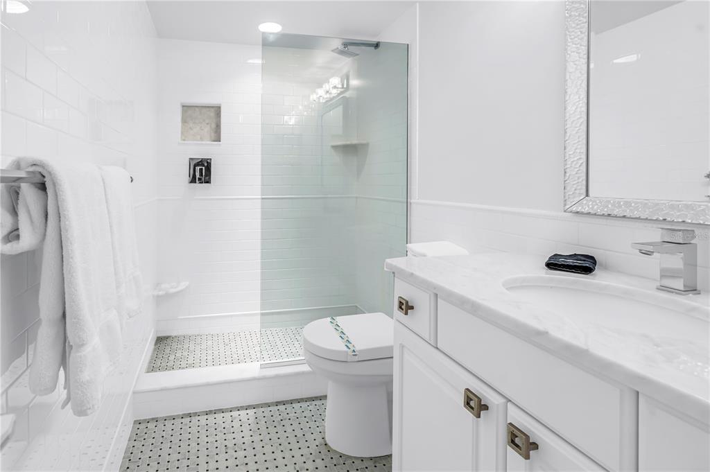 450 Beach Road, Unit 4 Sarasota, FL 34242 - Photo 38 of 64 a bathroom with a sink a toilet and shower