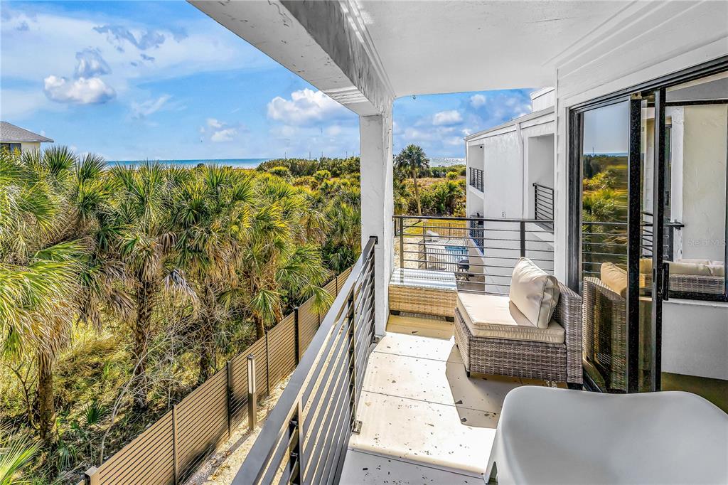 450 Beach Road, Unit 4 Sarasota, FL 34242 - Photo 40 of 64 a balcony with view of outdoor space