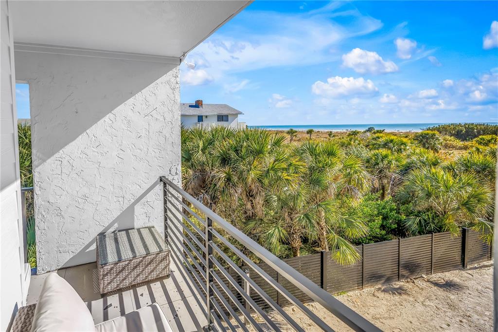 450 Beach Road, Unit 4 Sarasota, FL 34242 - Photo 41 of 64 a view of balcony with wooden floor and fence