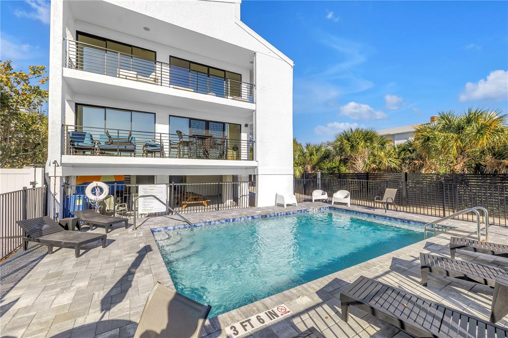 450 Beach Road, Unit 4 Sarasota, FL 34242 - Photo 45 of 64 a view of a house with pool porch and sitting area