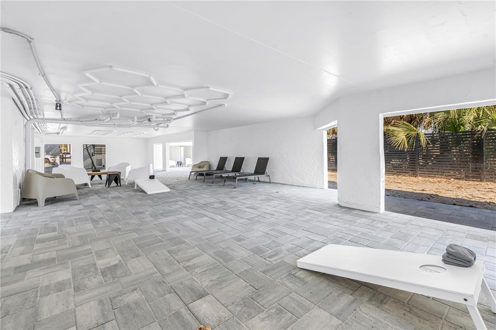 450 Beach Road, Unit 4 Sarasota, FL 34242 - Photo 51 of 64 a living room with furniture and a floor to ceiling window