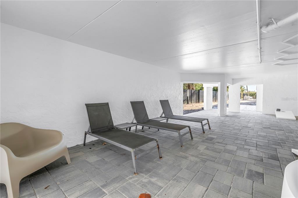 450 Beach Road, Unit 4 Sarasota, FL 34242 - Photo 55 of 64 a living room with furniture and a window