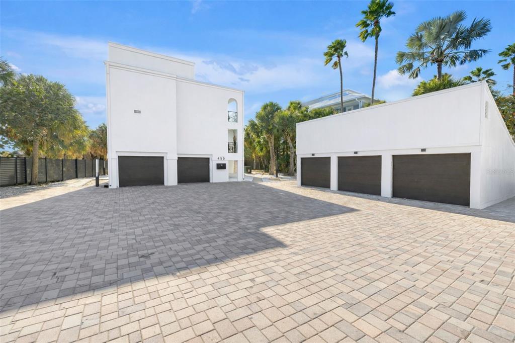 450 Beach Road, Unit 4 Sarasota, FL 34242 - Photo 6 of 64 a front view of a house with a yard and garage