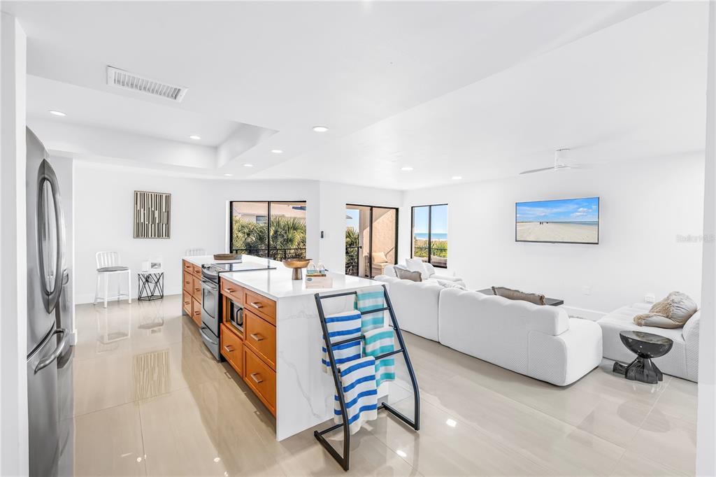 450 Beach Road, Unit 4 Sarasota, FL 34242 - Photo 8 of 64 a living room with furniture and a large window