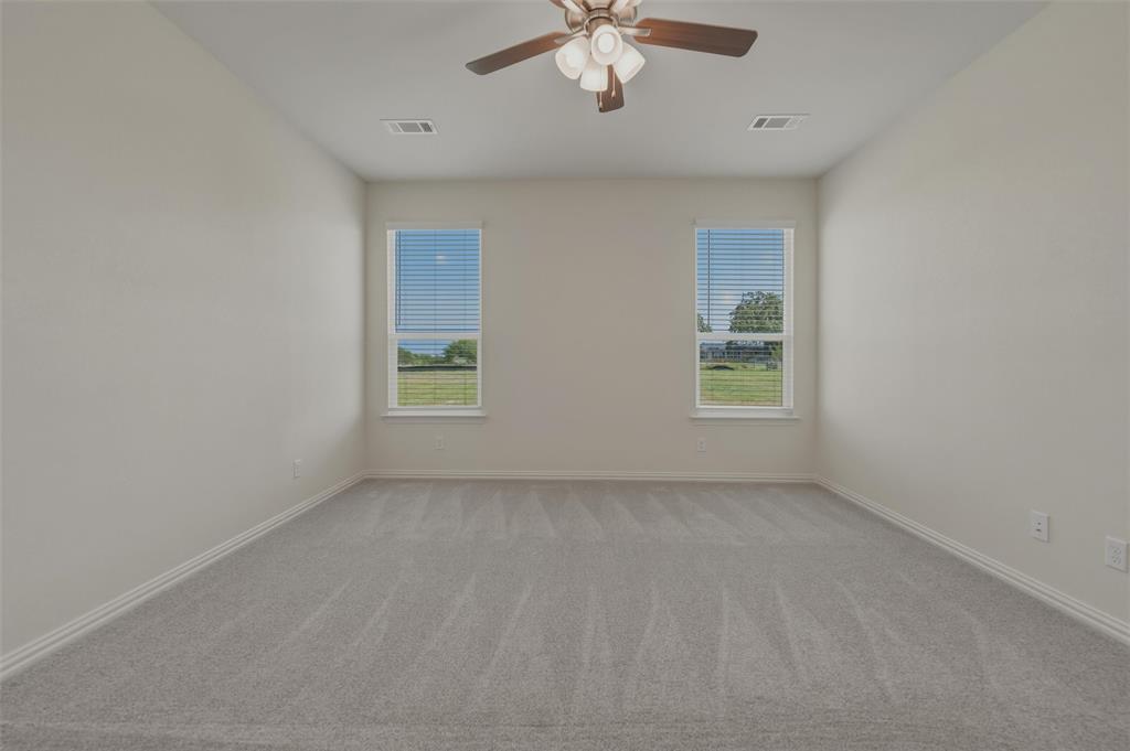 1113 Trinity Drive Springtown, TX 76082 - Photo 19 of 40 Recessed lighting, ceiling fan with light fixture, two windows, wall-to-wall carpeting
