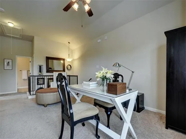 a dining room with furniture and chandelier