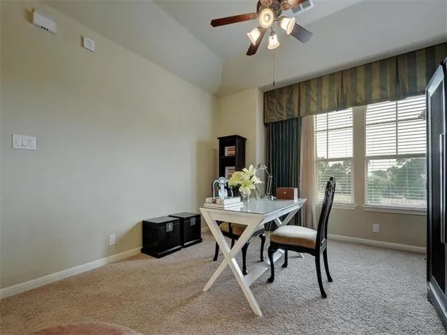 a workspace with furniture and window