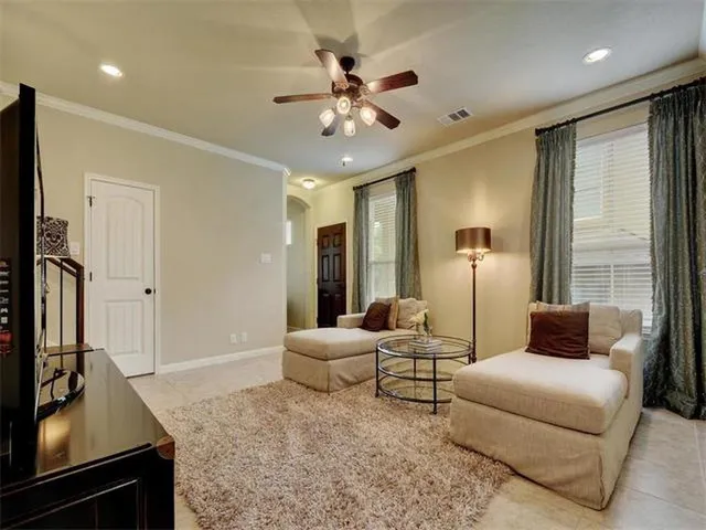 a living room with furniture and a large window