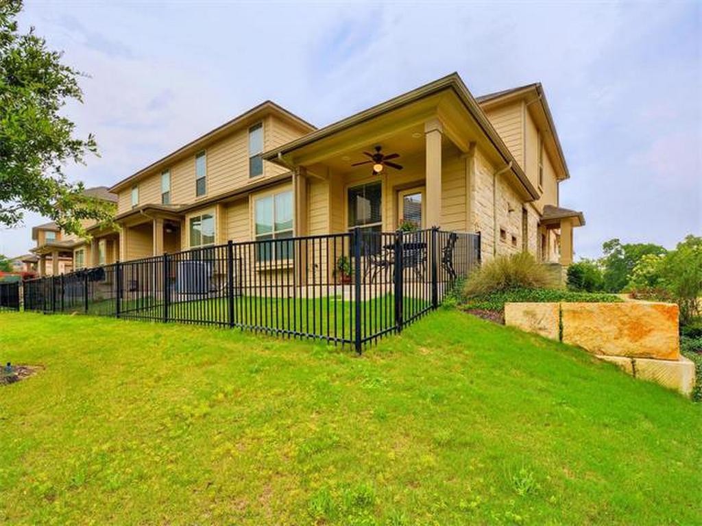 14001 Avery Ranch Boulevard, Unit 401 Austin, TX 78717 - Photo 2 of 29 a view of a house with a yard and sitting area