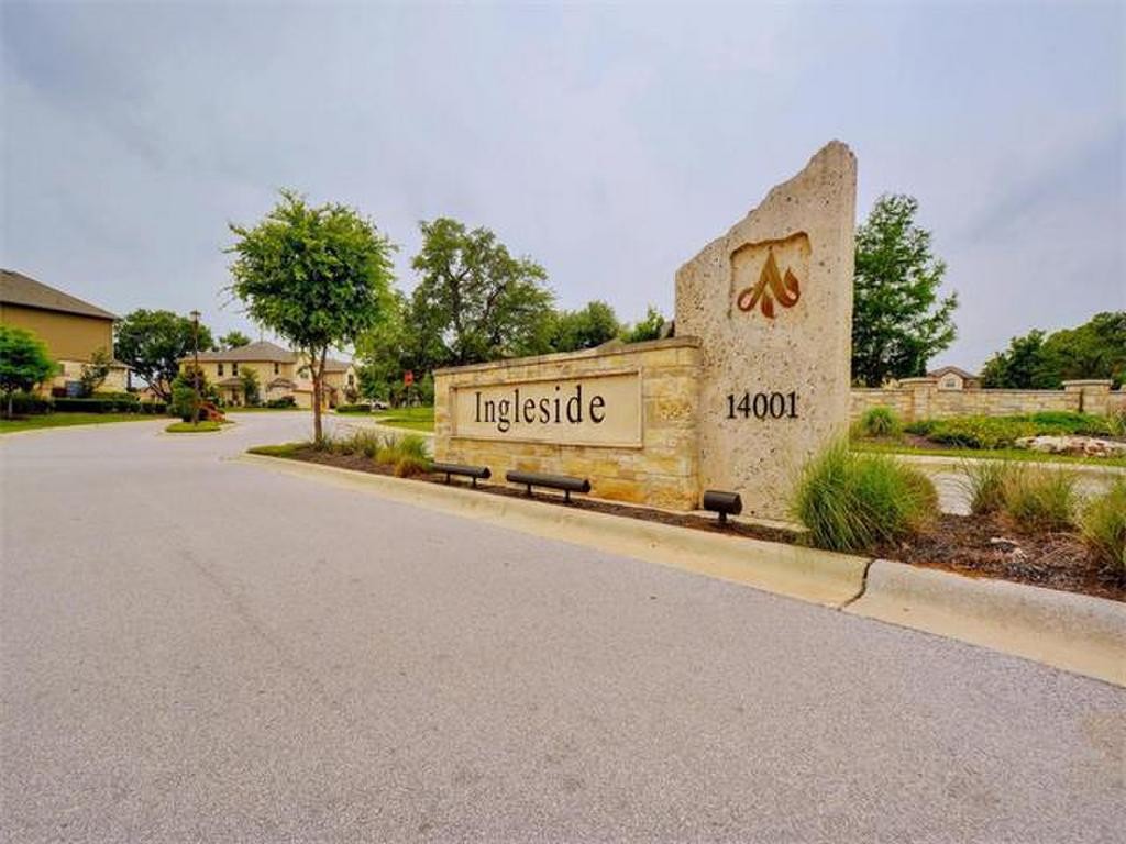 14001 Avery Ranch Boulevard, Unit 401 Austin, TX 78717 - Photo 27 of 29 a view of a street with a building and trees in the background