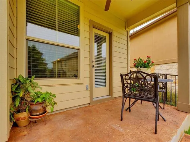 a view of a chair and table in the patio