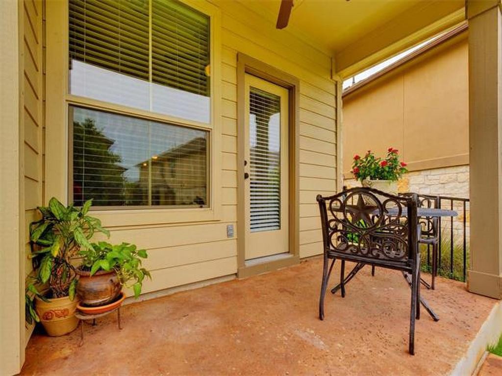 14001 Avery Ranch Boulevard, Unit 401 Austin, TX 78717 - Photo 4 of 29 a view of a chair and table in the patio
