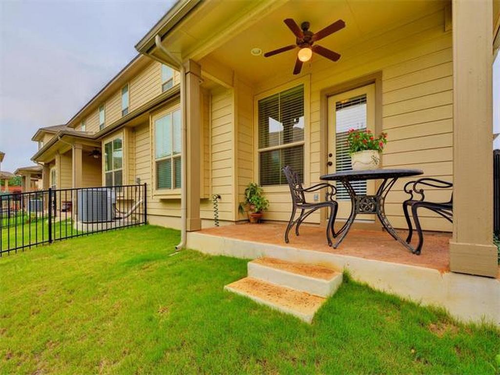 14001 Avery Ranch Boulevard, Unit 401 Austin, TX 78717 - Photo 5 of 29 a view of a house with backyard porch and sitting area