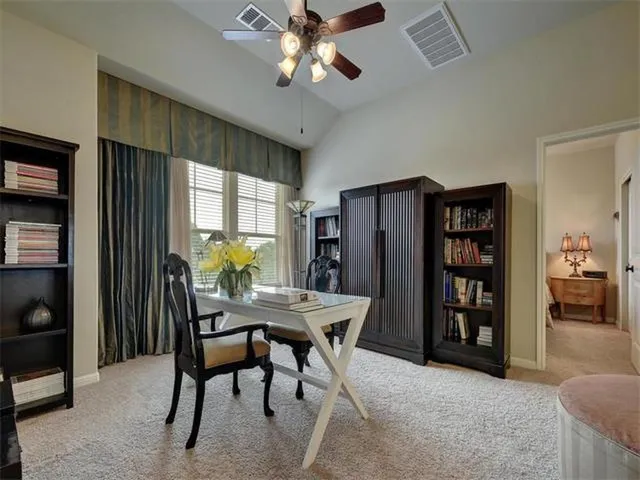 a workspace with furniture and window