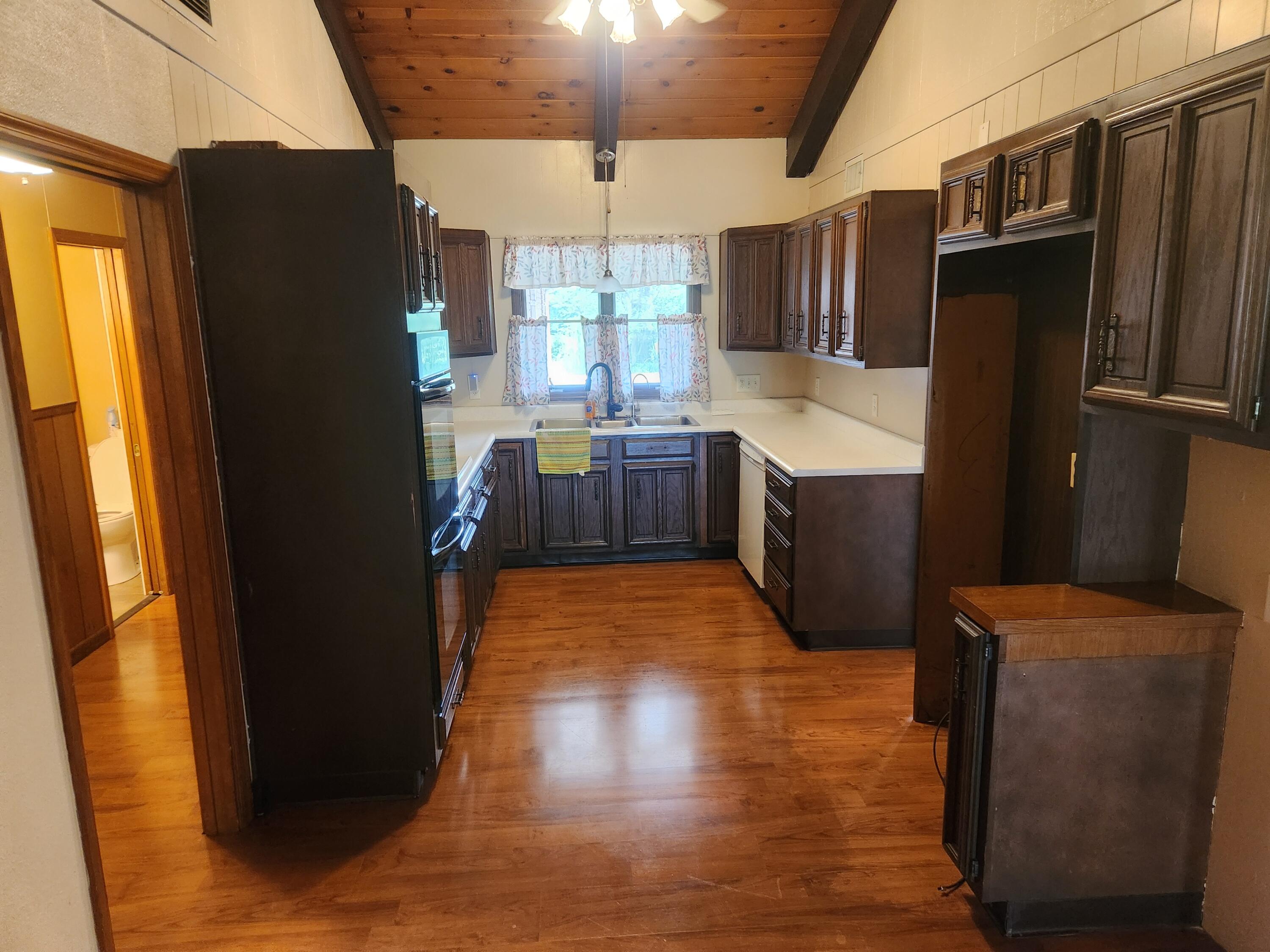 4726 Locksley Drive East Rensselaer, IN 47978 - Photo 7 of 33 a kitchen with refrigerator and window