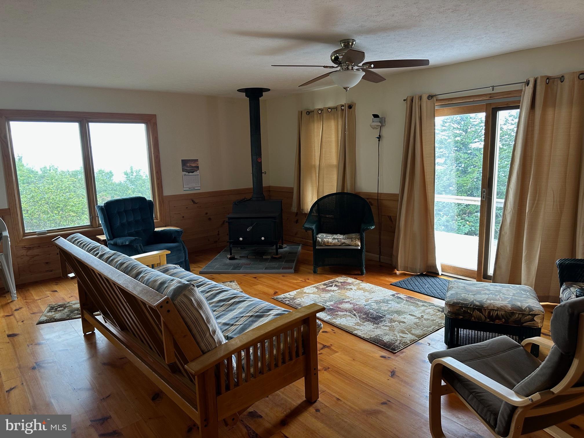 46 Pond Road Franklin, WV 26807 - Photo 2 of 28 a living room with furniture and a large window