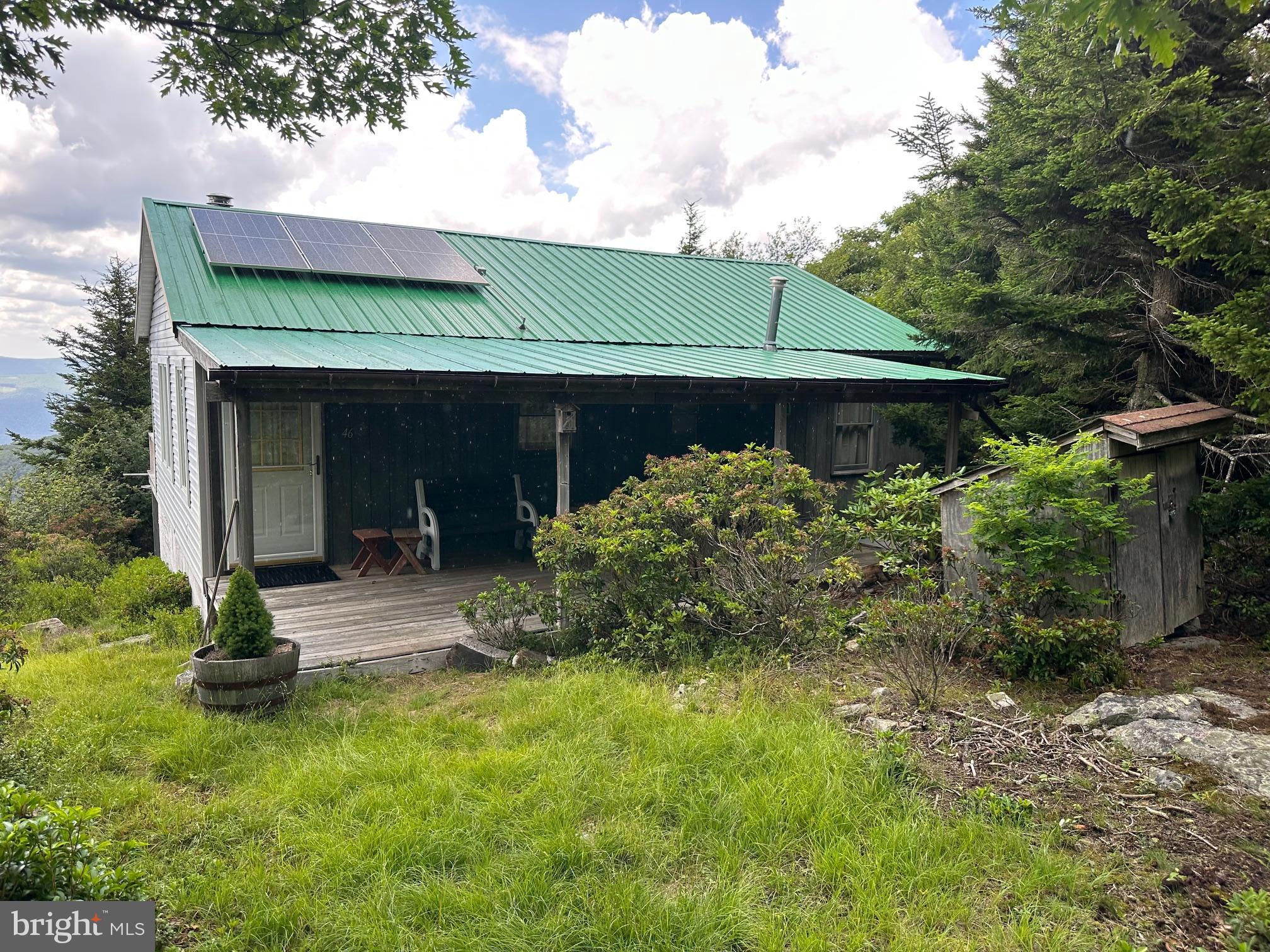 46 Pond Road Franklin, WV 26807 - Photo 28 of 28 a front view of a house with garden