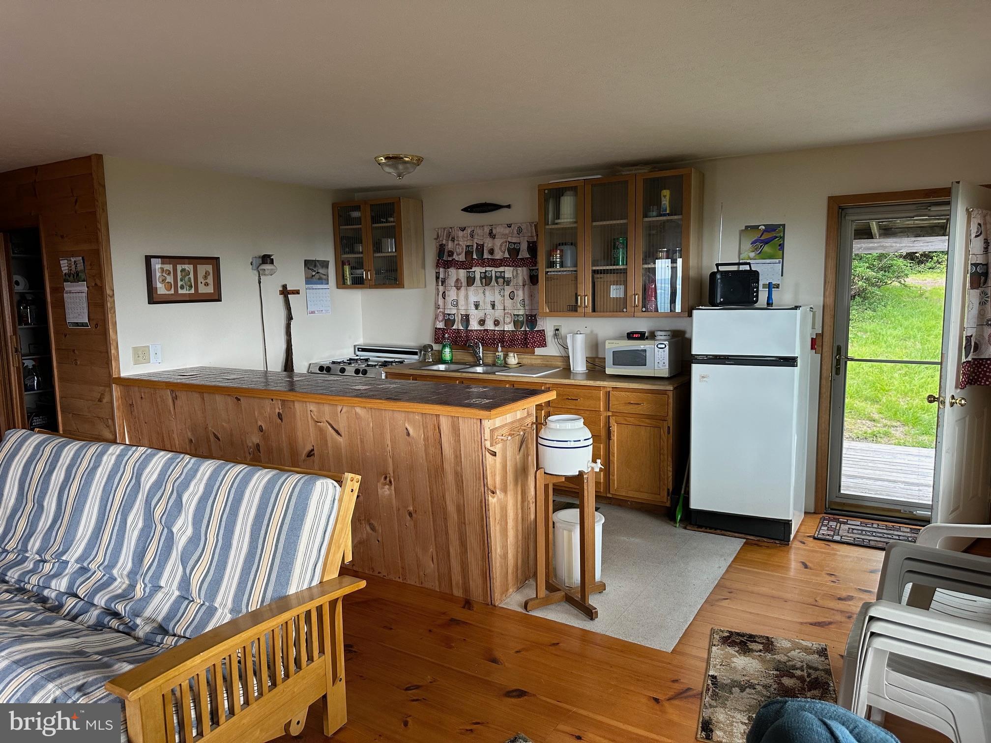 46 Pond Road Franklin, WV 26807 - Photo 3 of 28 a living room with furniture and a table