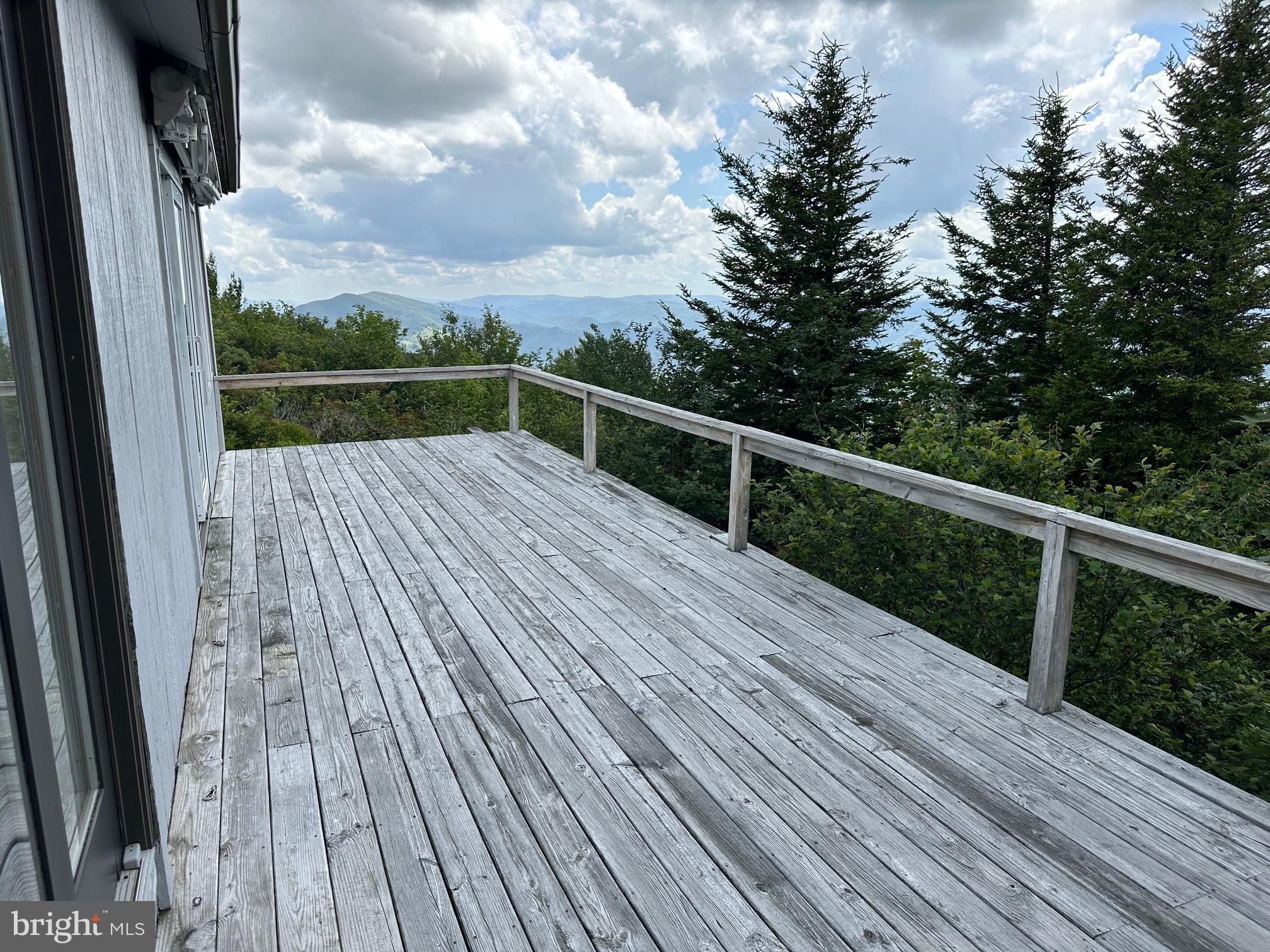 46 Pond Road Franklin, WV 26807 - Photo 6 of 28 a view of terrace with wooden floor and fence