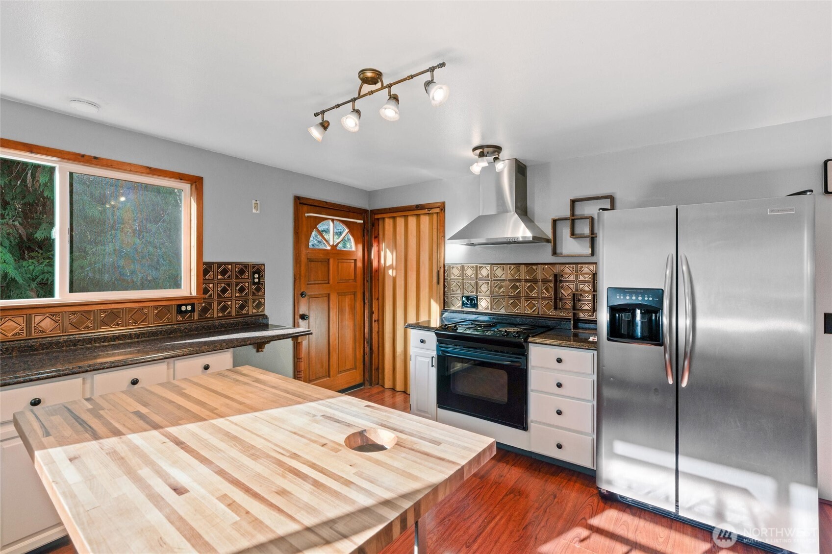 155 Blueberry Hill Road Port Ludlow, WA 98365 - Photo 16 of 39 a kitchen with stainless steel appliances a sink stove and refrigerator