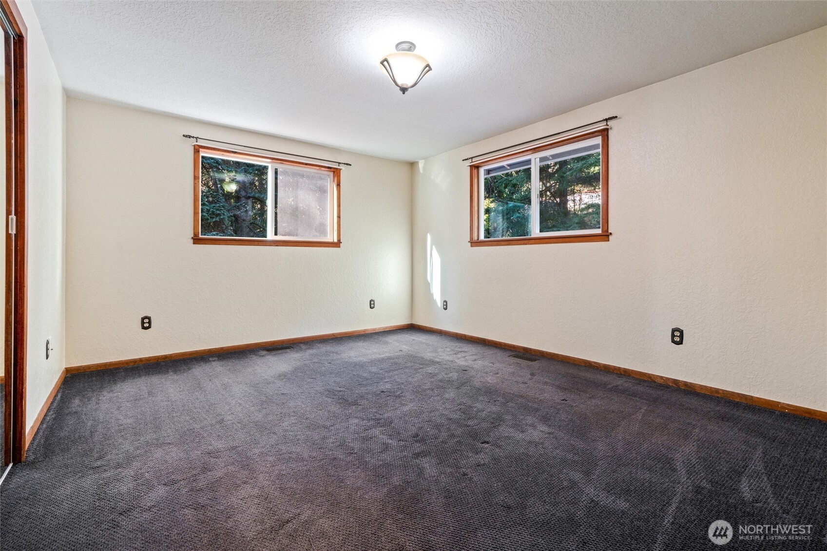 155 Blueberry Hill Road Port Ludlow, WA 98365 - Photo 22 of 39 an empty room with a window