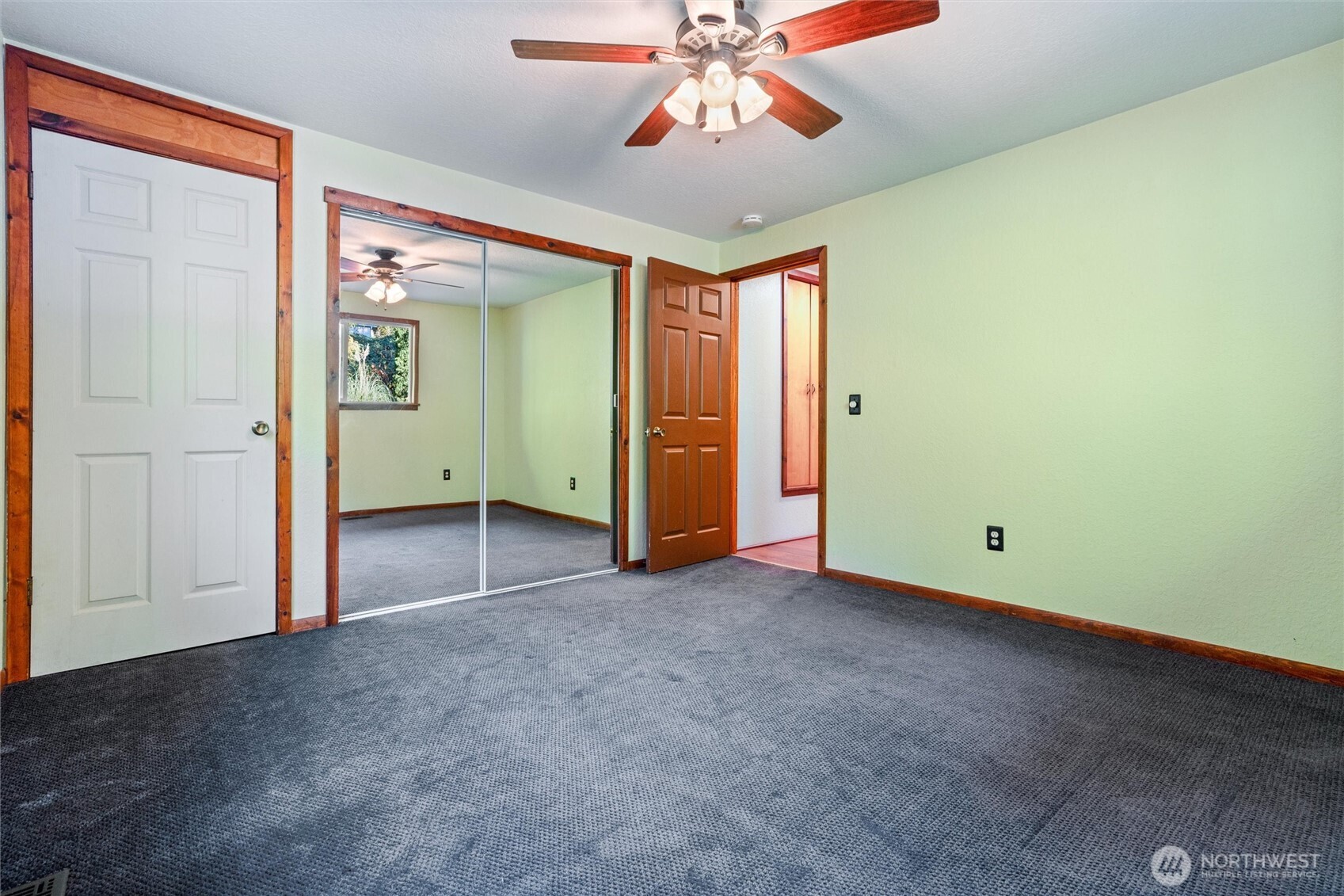 155 Blueberry Hill Road Port Ludlow, WA 98365 - Photo 24 of 39 an empty room with closet and windows