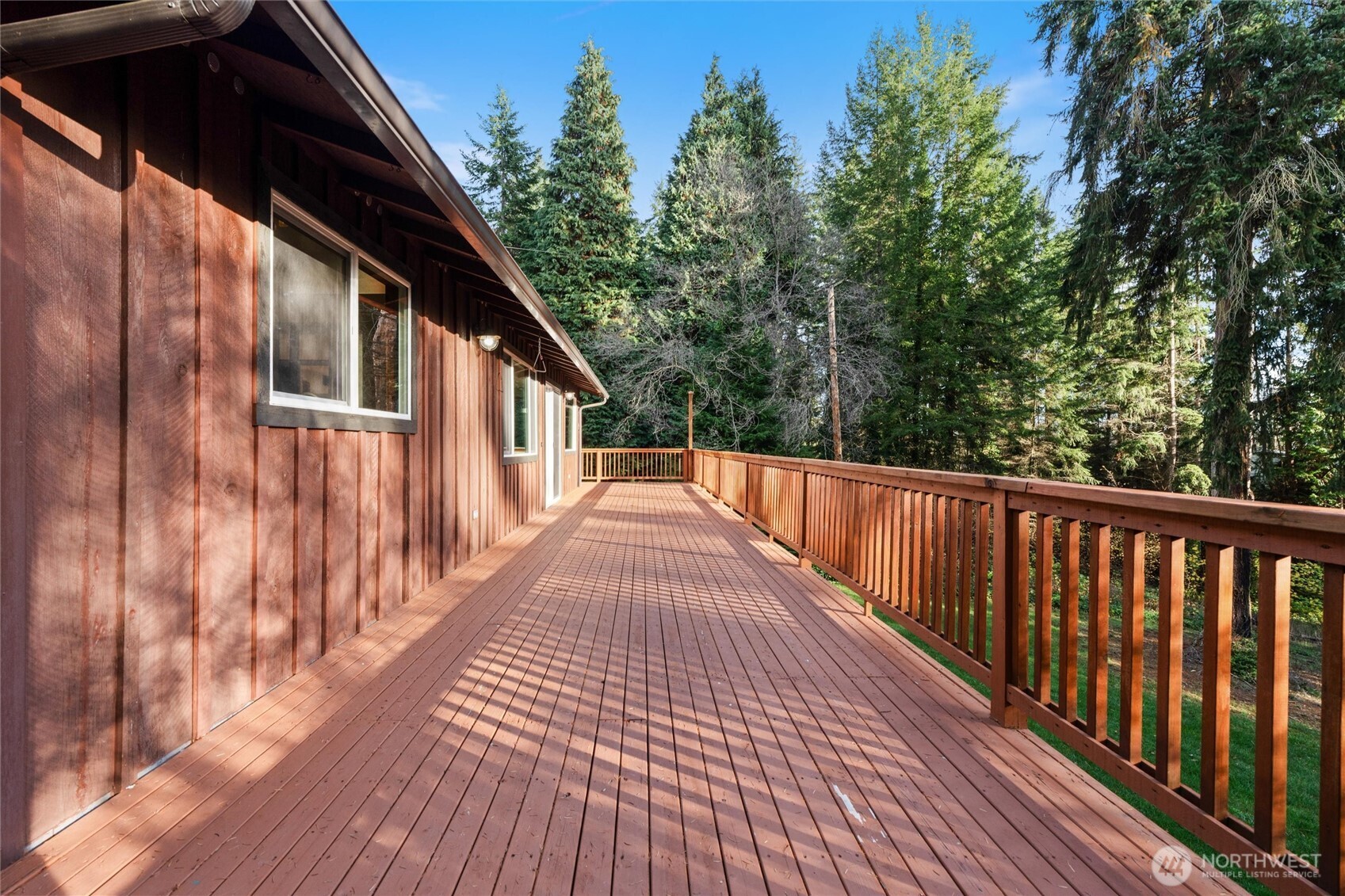 155 Blueberry Hill Road Port Ludlow, WA 98365 - Photo 31 of 39 a view of balcony with wooden floor and fence