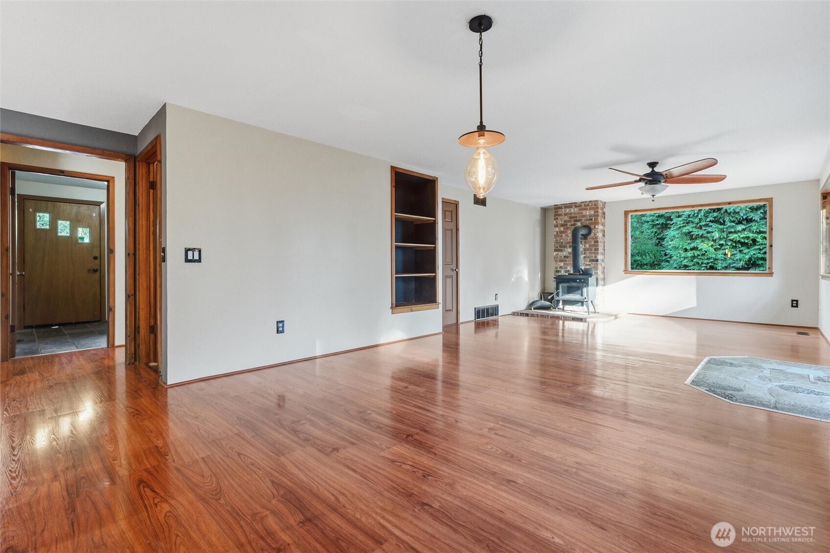 155 Blueberry Hill Road Port Ludlow, WA 98365 - Photo 6 of 39 a view of a livingroom with wooden floor and stairs