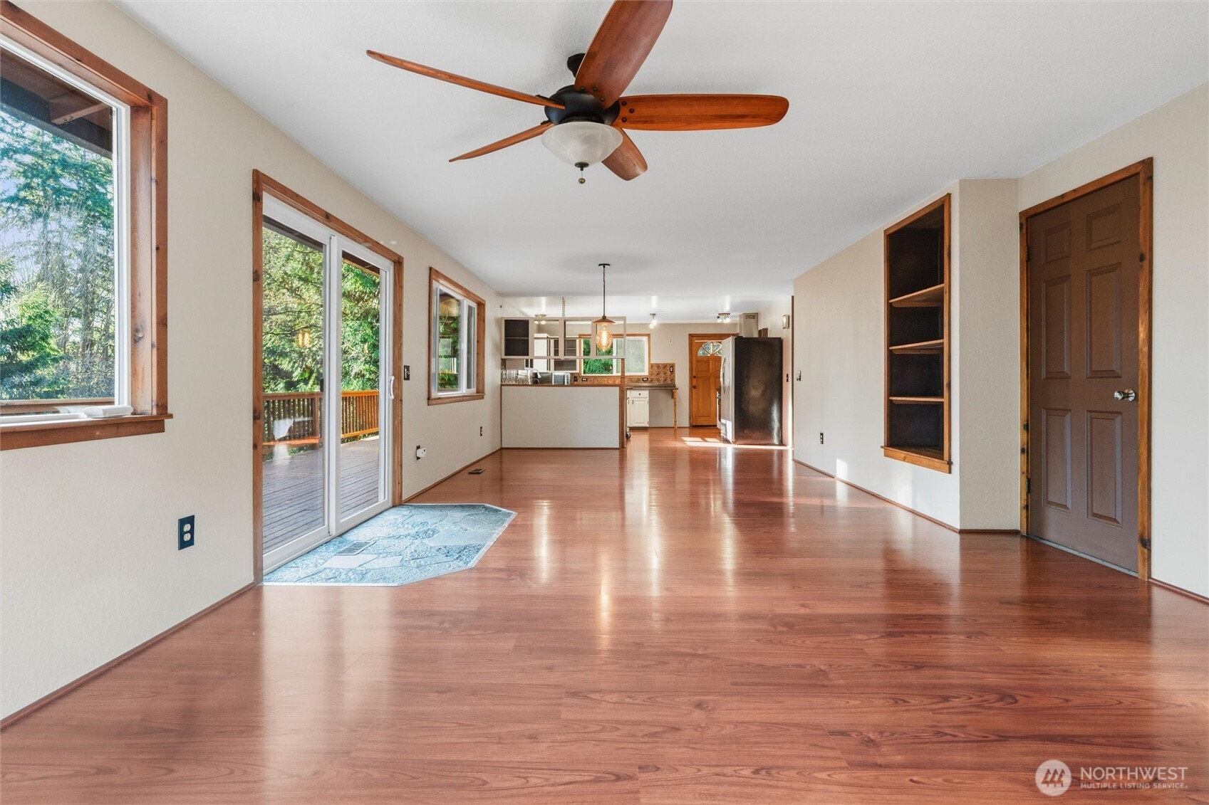 155 Blueberry Hill Road Port Ludlow, WA 98365 - Photo 9 of 39 a view of an empty room with wooden floor and a window