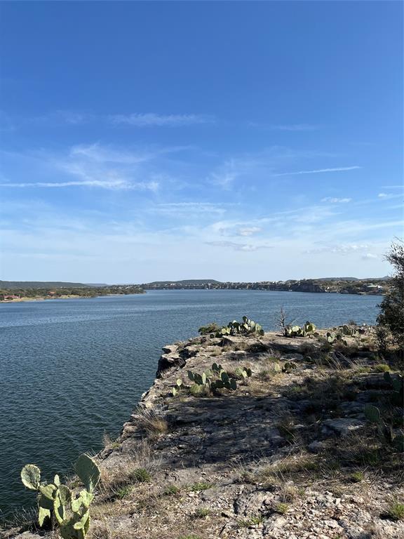 105 Hells Gate Point Strawn, TX 76475 - Photo 1 of 1 a view of a ocean with beach