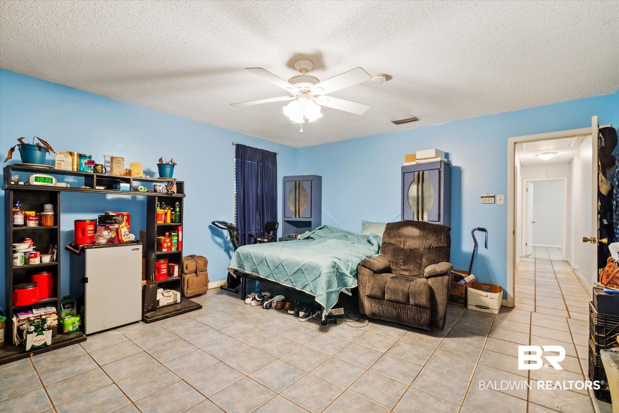 6657 Hounds Run South Mobile, AL 36608 - Photo 10 of 20 Tiled bedroom featuring a textured ceiling and ceiling fan