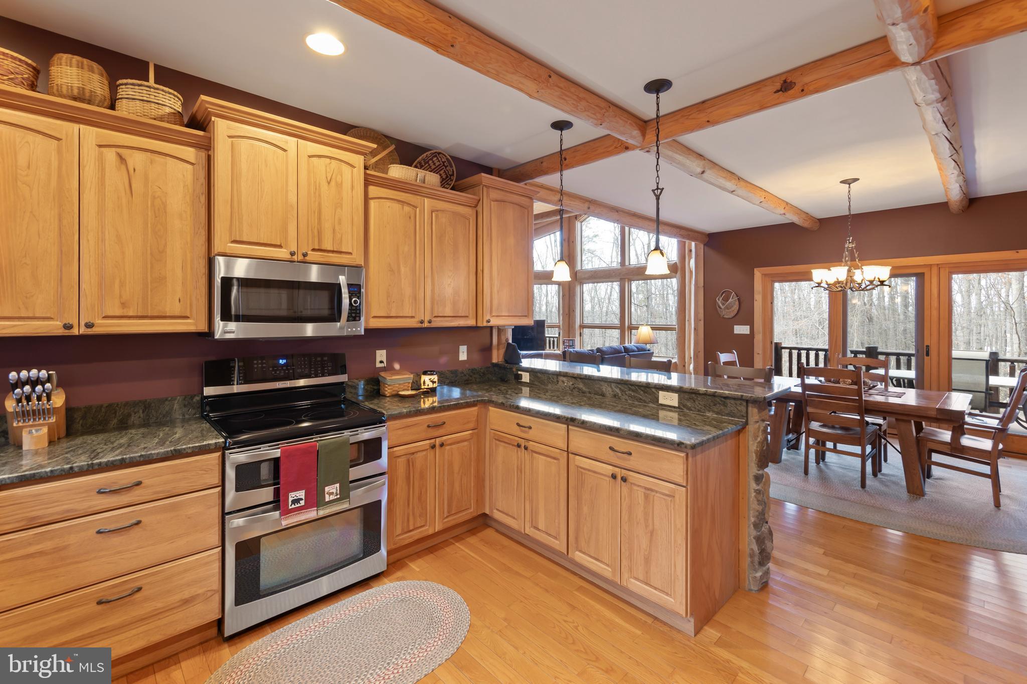 181 Signal Ridge Lane Winchester, VA 22603 - Photo 26 of 70 a kitchen with stainless steel appliances granite countertop a stove and a sink