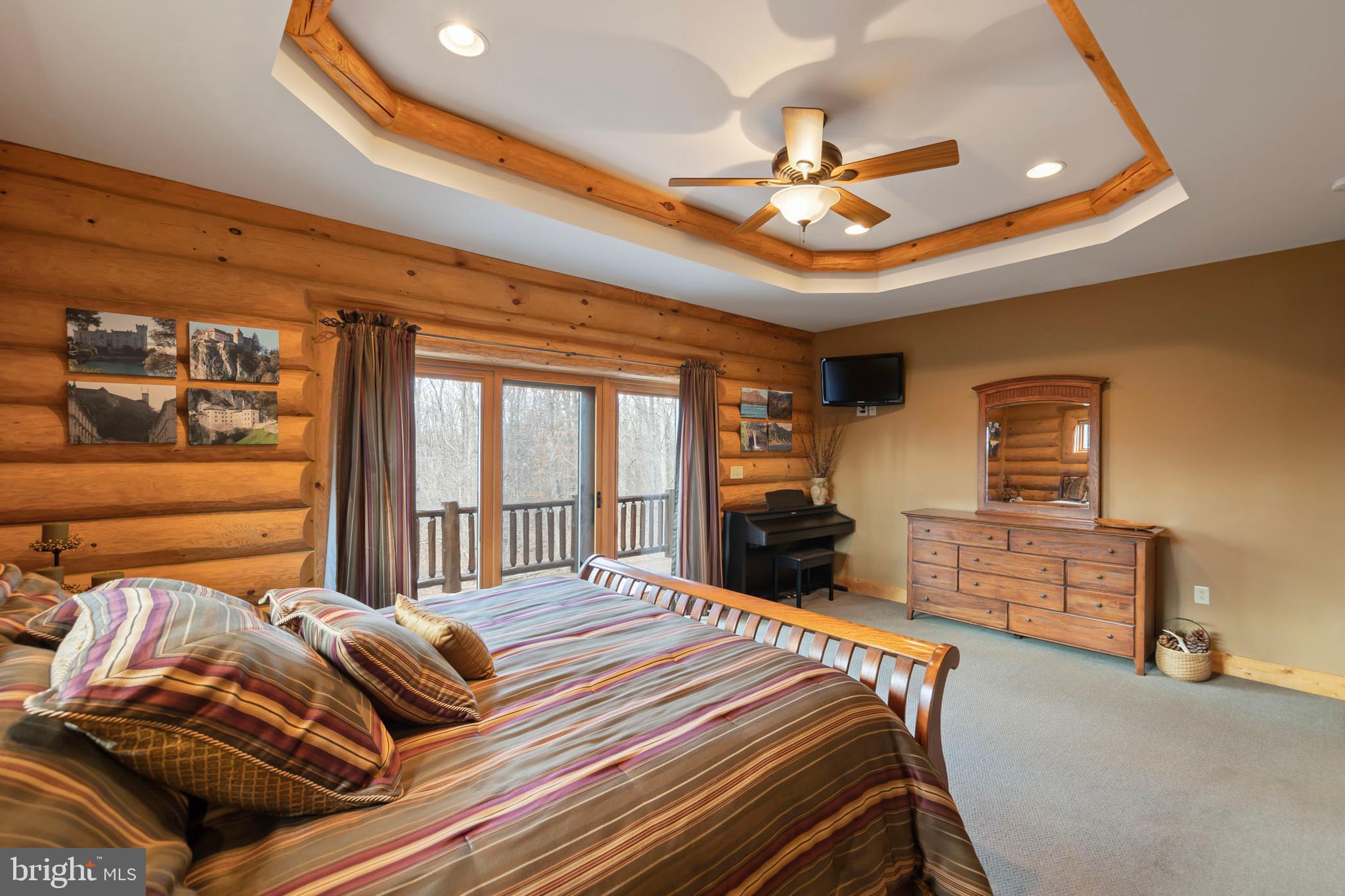 181 Signal Ridge Lane Winchester, VA 22603 - Photo 35 of 70 a bedroom with a bed and wooden floor