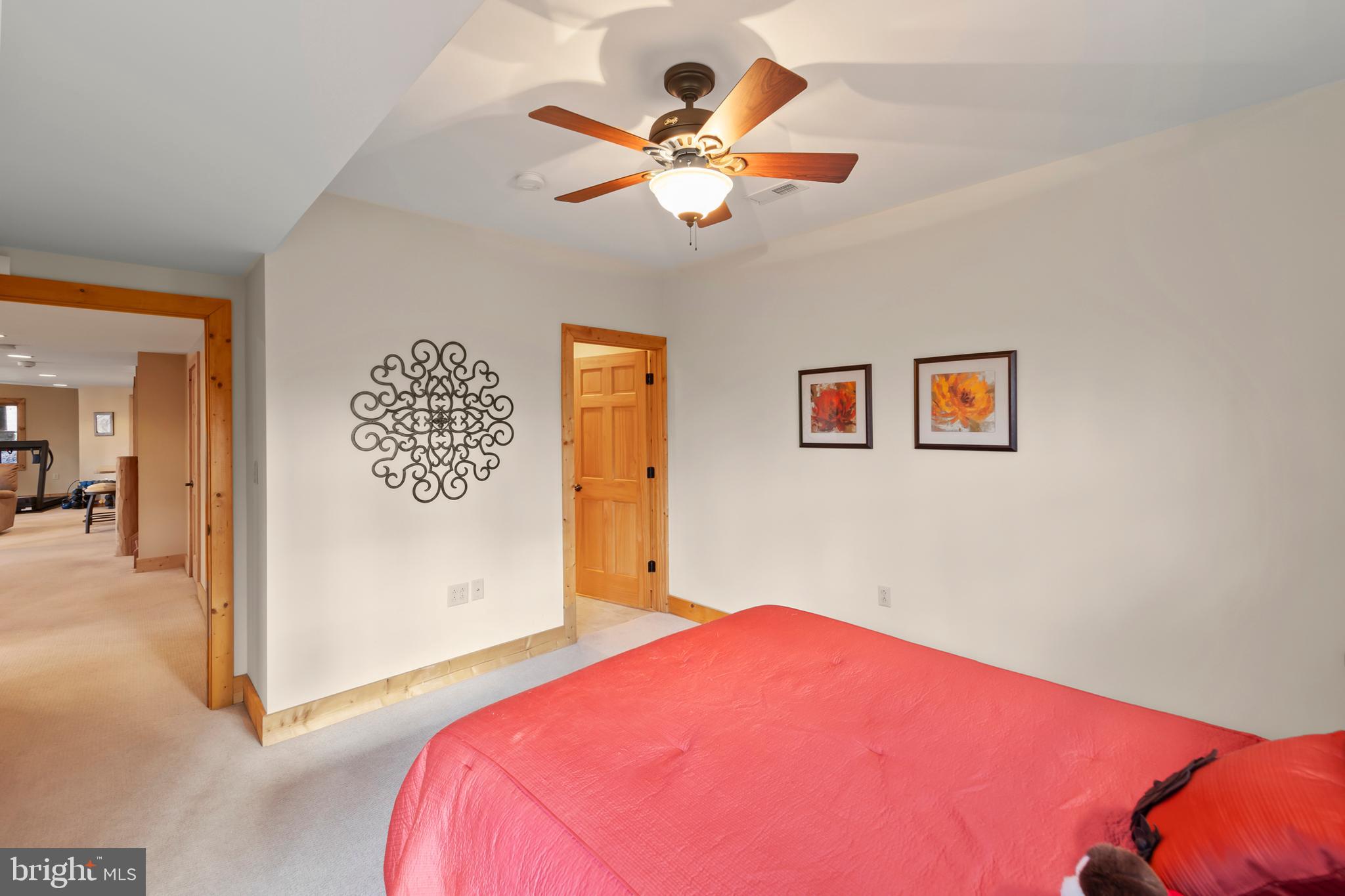 181 Signal Ridge Lane Winchester, VA 22603 - Photo 41 of 70 a bedroom with a bed and a chandelier